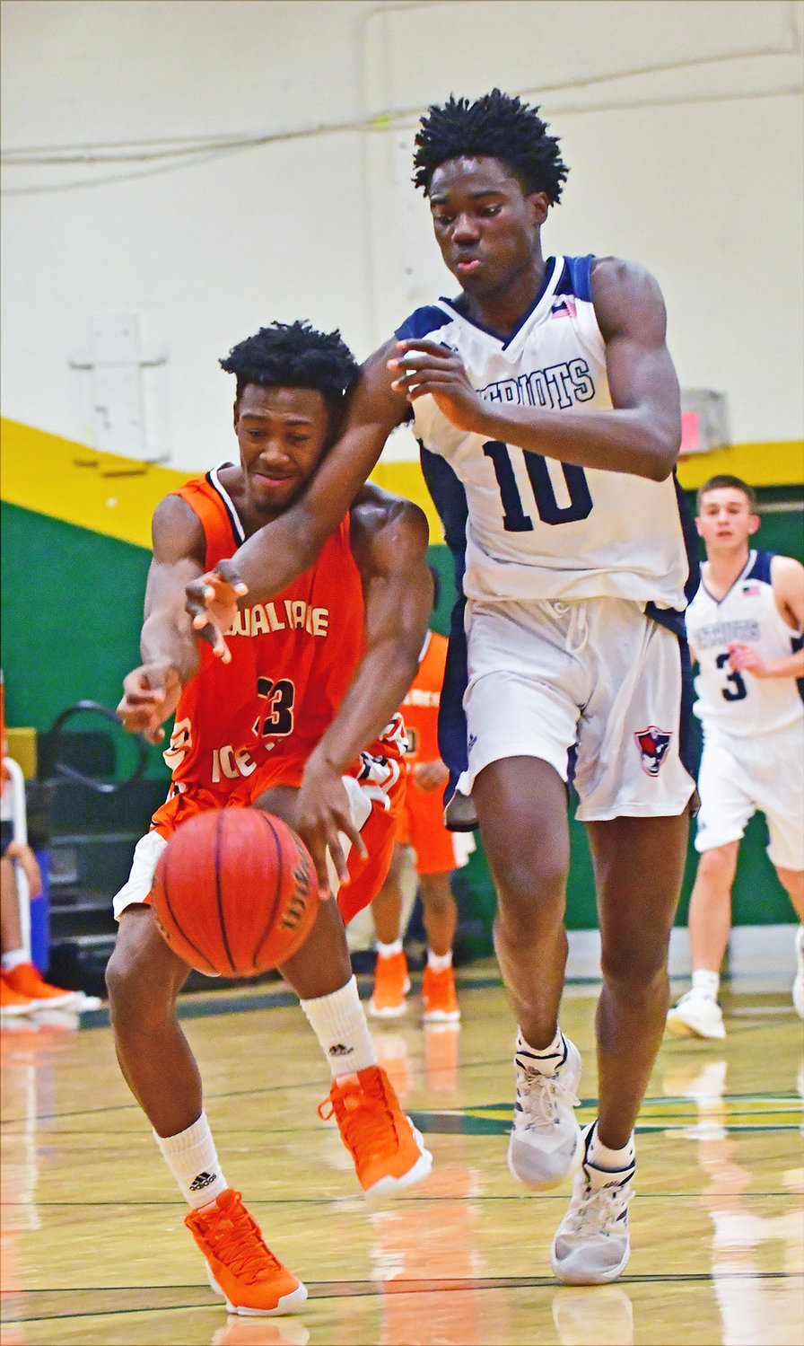 Wallace-Rose Hill's Zalen Hall, left, tries to steal the ball from Apex Friendship's Jayden Beloti in first round action of the 1st Bank Charger Classic.