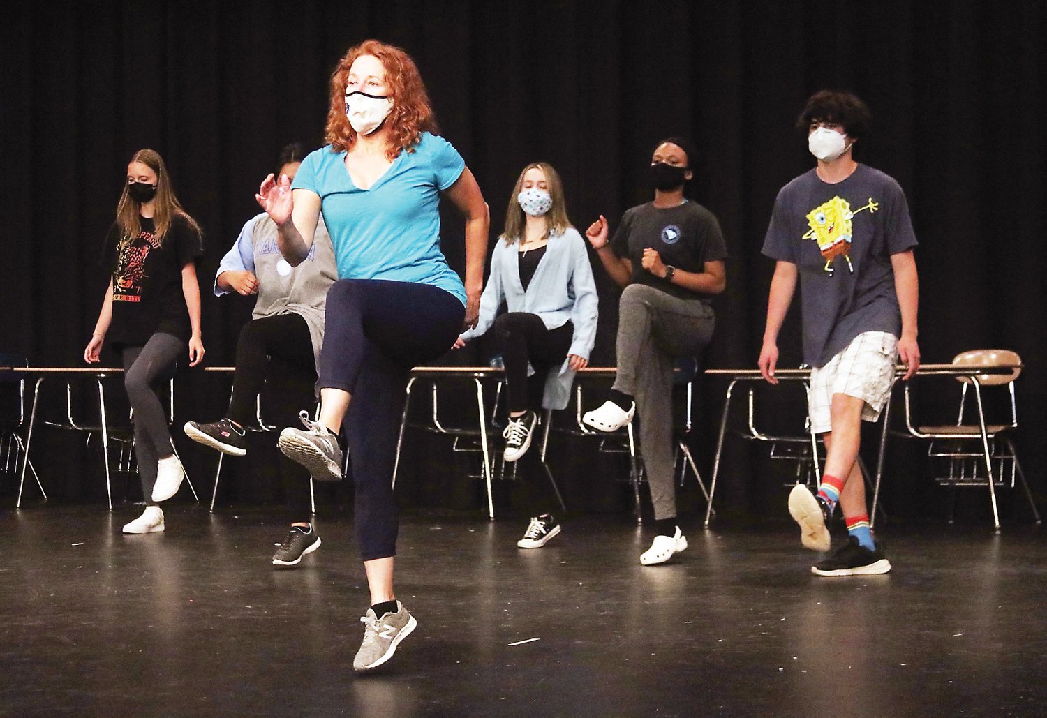 Peggy Taphorn, Producing Artistic Director for Temple Theatre in Sanford, teaches steps during the six-hour JMArts Theater Dance Workshop at Jordan-Matthews High School last summer.