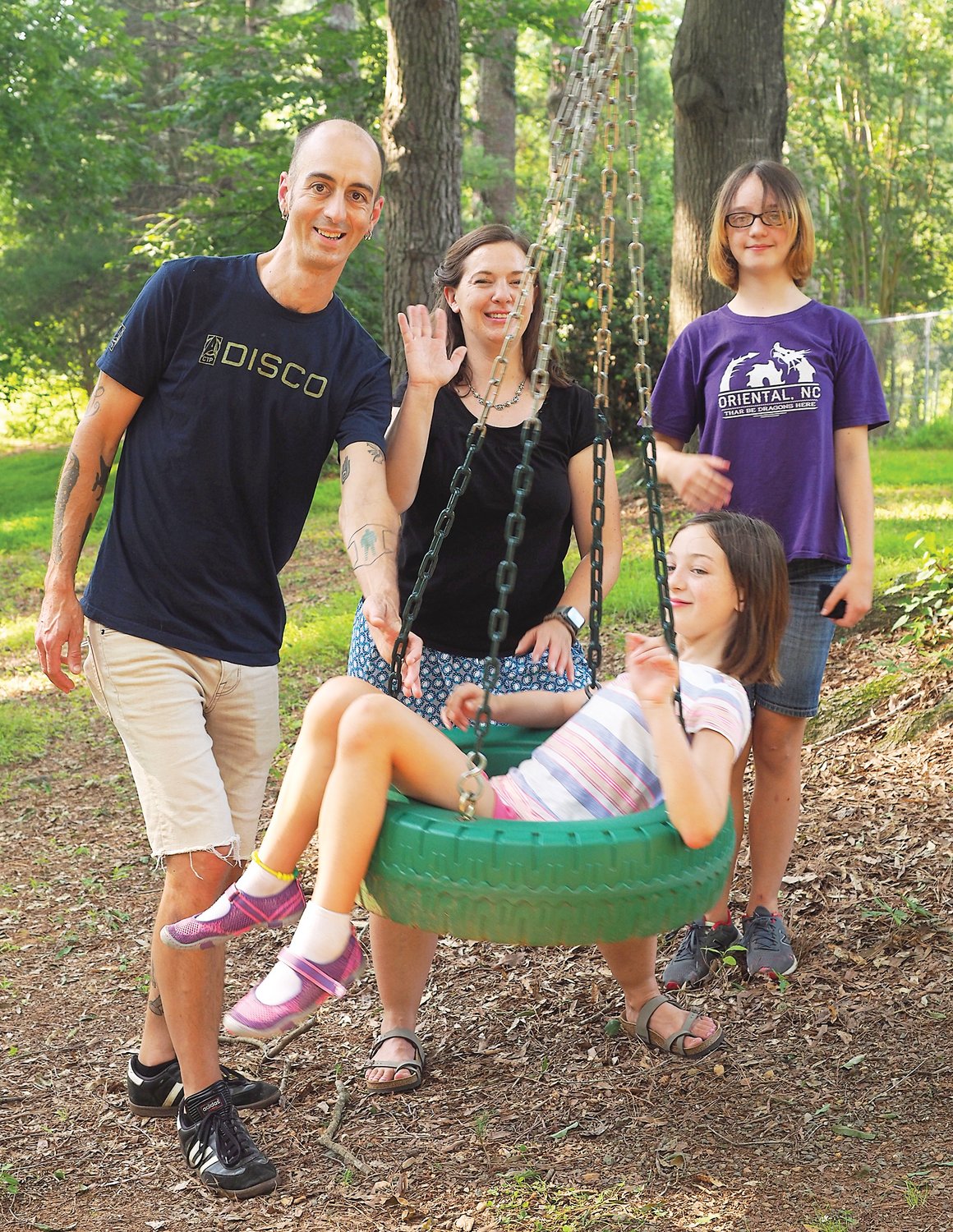 Corbie Hill poses with wife Rachel and their daughters, Sarah (right) and Lucy (in striped shirt).
