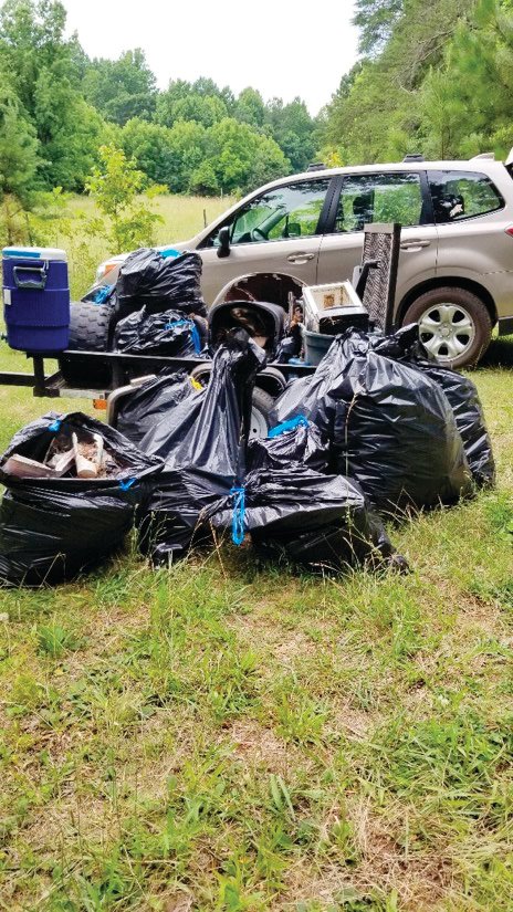 Volunteers at the first 'Creek Week' collected a a dozen bags of trash during the clean-up of a portion of the upper Rocky River.