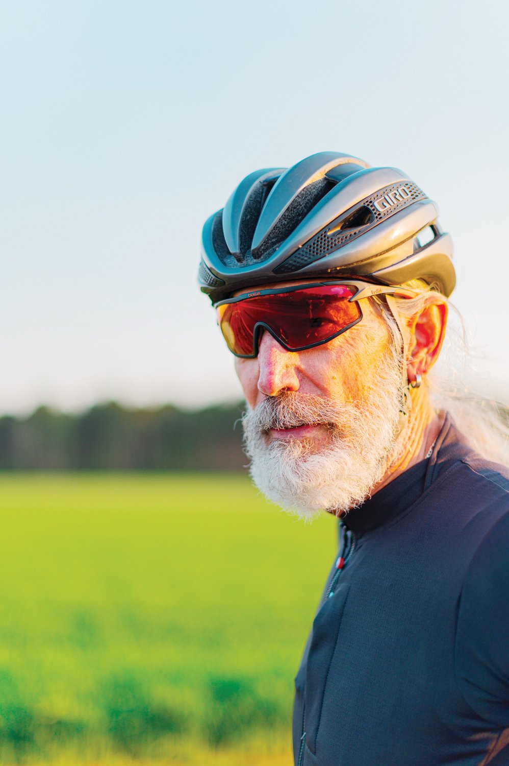 Chuck Gillis, a Pittsboro local and cycling expert, sports his amber red cycling glasses.paired with a form-fitting Giro helmet. Chuck is a huge advocate of riding safely whether that’s signaling or wearing proper gear.