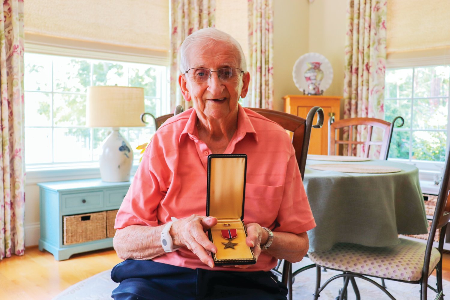 Hart shows off his Bronze Star award, given for his exemplary service during the Battle of the Bulge in World War II. Knowing about the Bronze Star encouraged his daughters agree to a friend's suggestion that Hart agree to a request to apply for the French Legion of Honor.