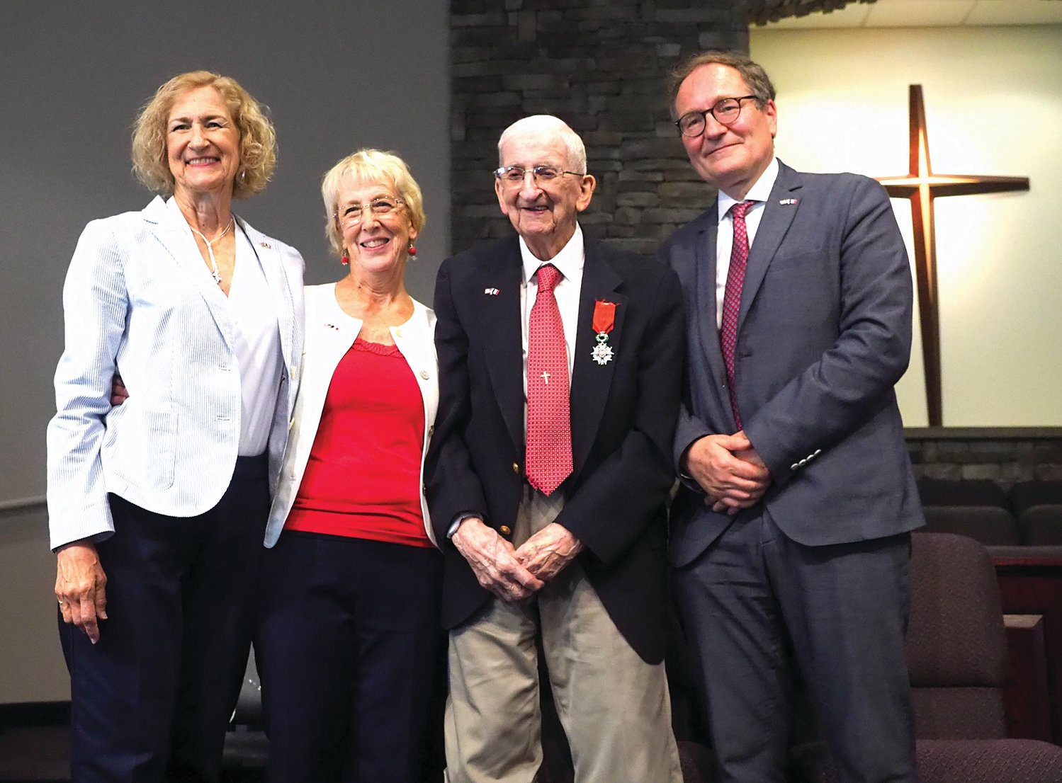 Wesley Hart, a 102-year-old Chatham County resident, poses following his bestowal with the French Legion of Honor. From left, daughters Lynne Dyer and Kathy Wakeman, Hart and Vincent Hommeril of the French consulate in Atlanta.