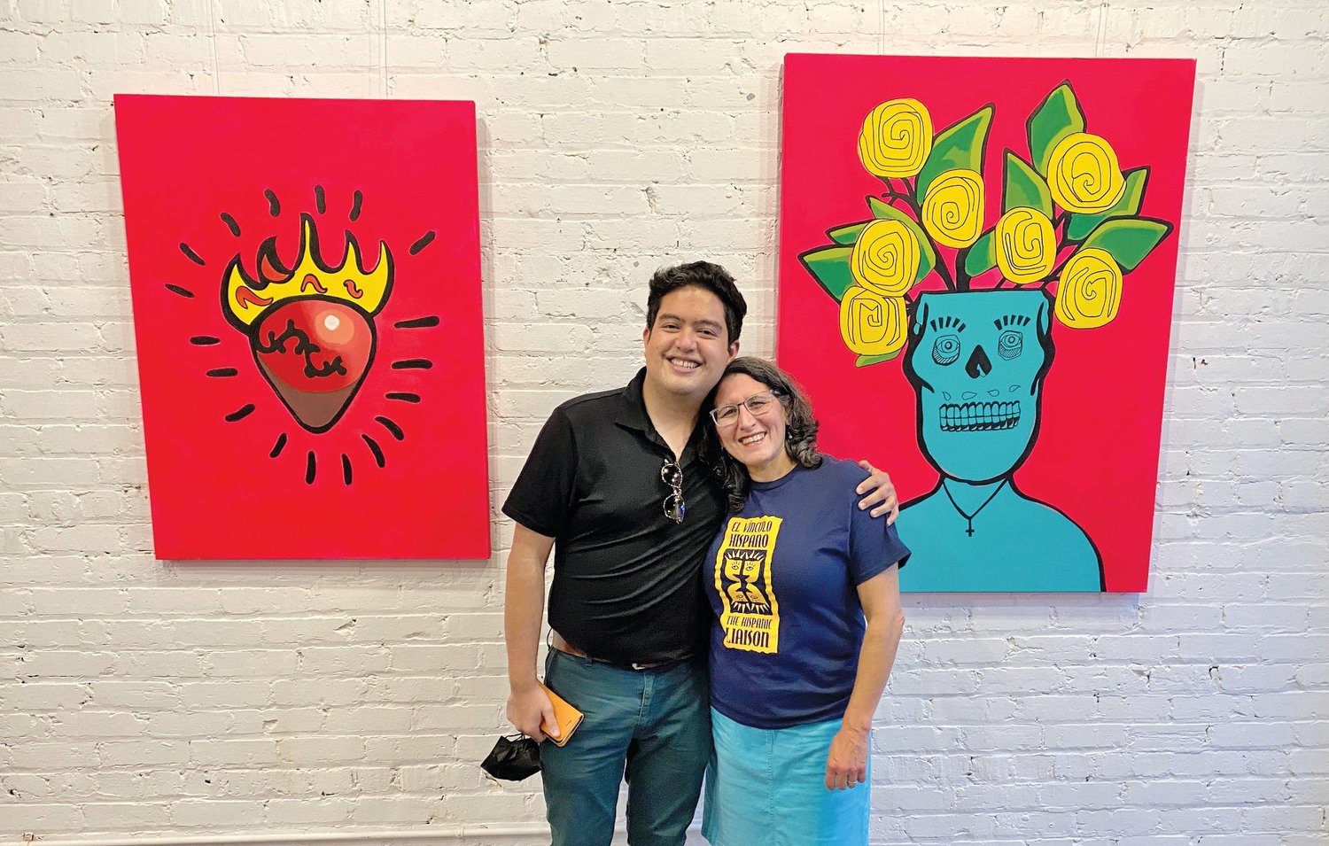 Mexican-American artist Antonio Alanís and the Hispanic Liaison's Ilana Dubester inside the N.C. Arts Incubator last Friday.