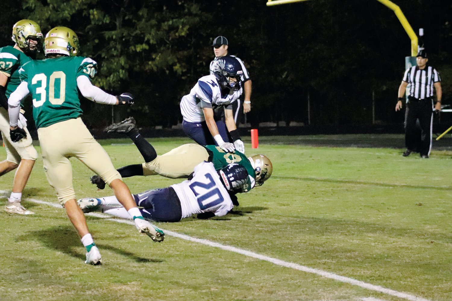 Northwood senior running back Dashaun Vines-McSwain (in green) is tackled into the end zone in the first quarter of the Chargers' 21-6 loss to Western Alamance last Friday. Vines-McSwain's 4-yard rush TD was the only score of the game for Northwood.