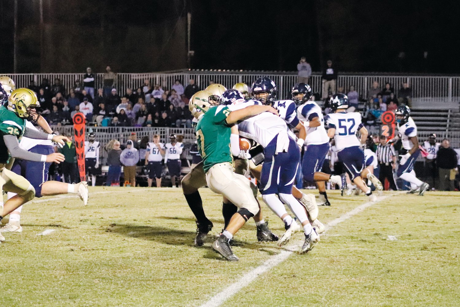 Northwood sophomore linebacker Ryan Brinker (27) brings down a Western Alamance ballcarrier during the Chargers' 21-6 loss to the Warriors last Friday. Brinker also blocked a punt in the first quarter.