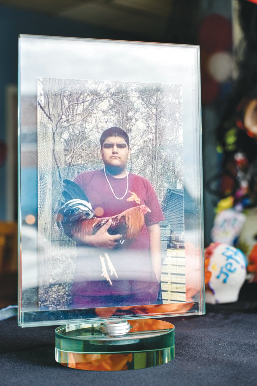 A photo of Bryan Vilchis, a junior at Northwood High School, died in a car crash on Old Graham Road on Oct. 23. CIS' Maria Soto constructed a Day of the Dead altar in his honor, placing his picture at the top of the altar. .