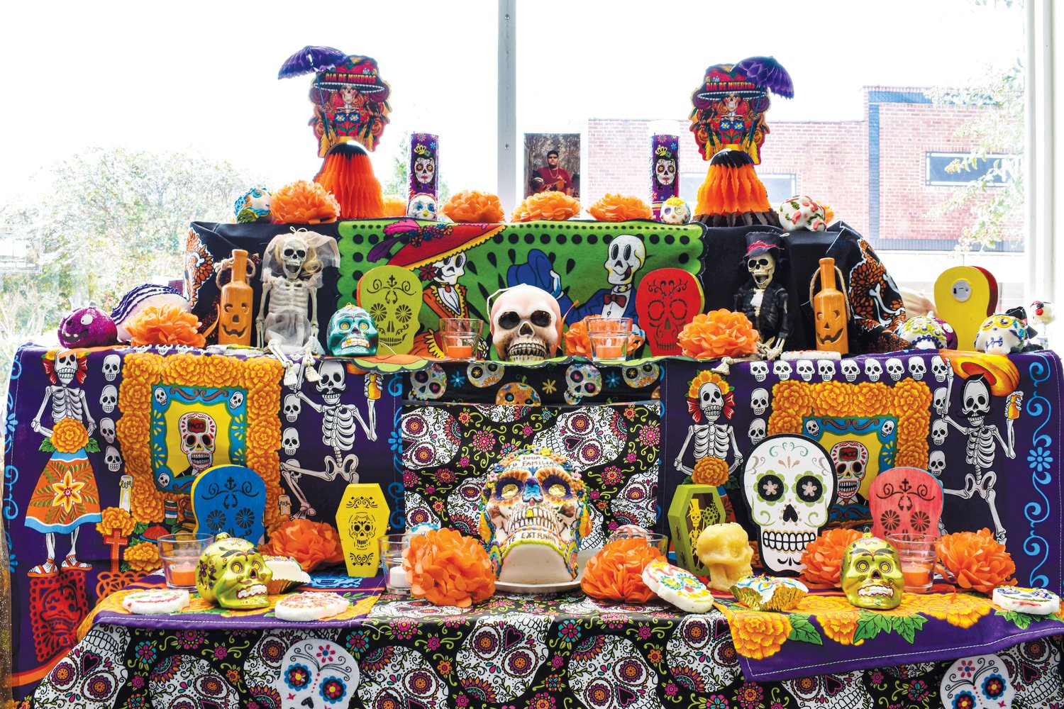 Communities In Schools’ Maria Soto constructed an altar inside the nonprofit’s Siler City office for Day of the Dead, or Día de Muertos, a Mexican and Latin American holiday in which people celebrate the lives of their deceased loved ones. She constructed this year's altar in honor of Bryan Vilchis, a Northwood student who died in a car crash on Oct. 23. .