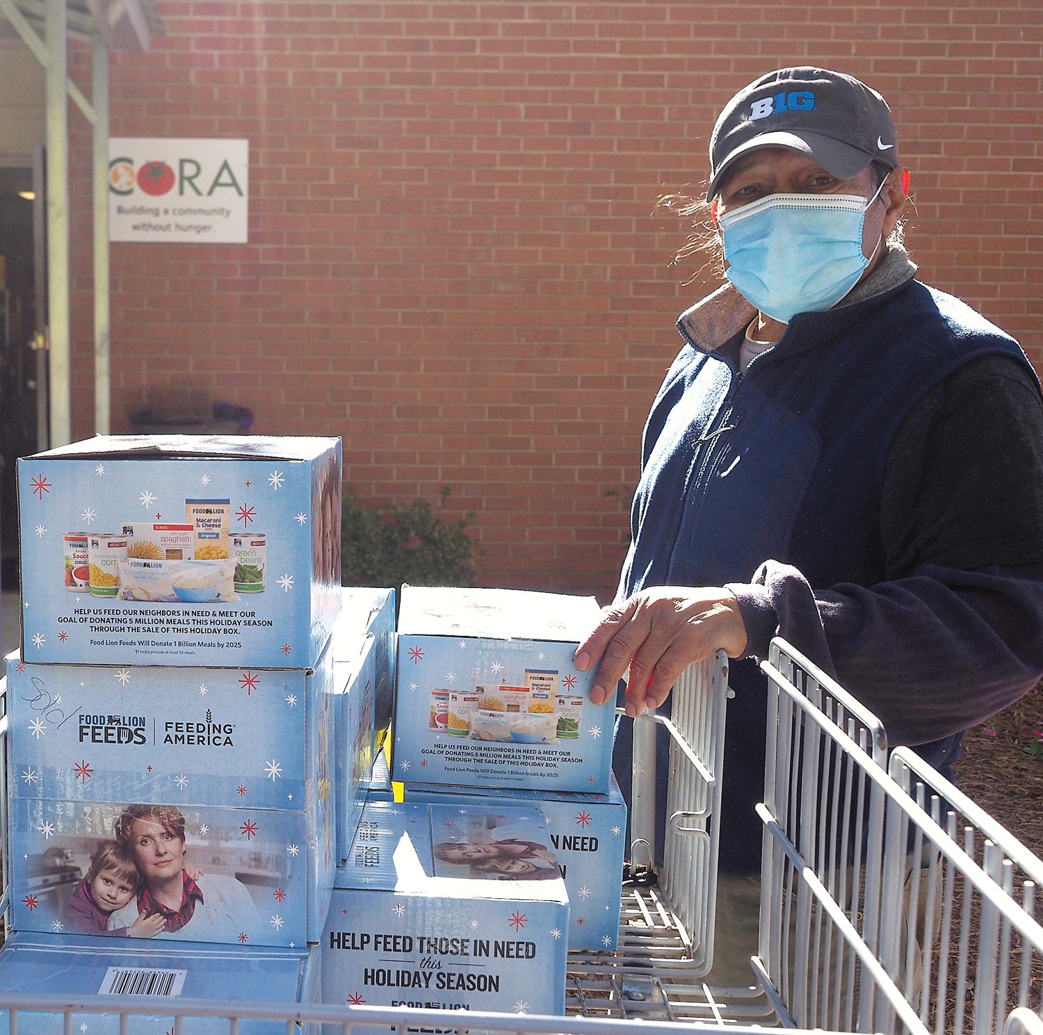 Enrique Romero-Hermandez, a CORA volunteer, helps prepare for the distribution.