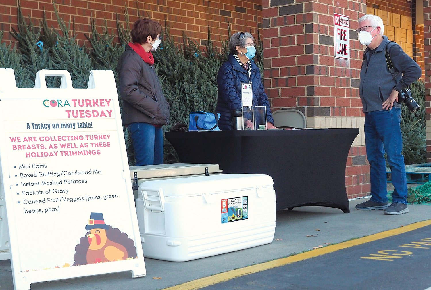 Volunteers working to collect food donations for CORA's 'Turkey Tuesday' food drive last week.