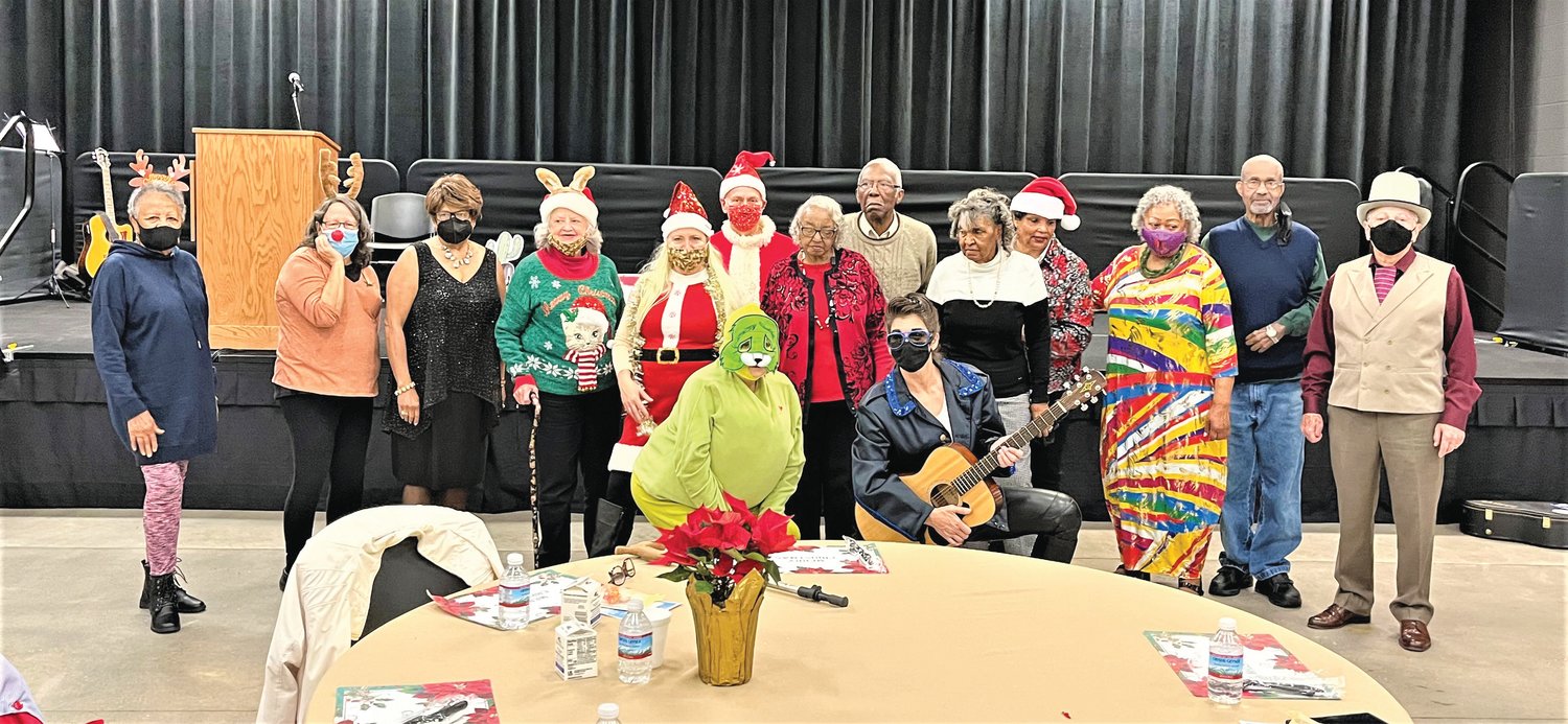 Participants from the COA's holiday party pose during events at the Chatham County Agriculture & Conference Center in Pittsboro.