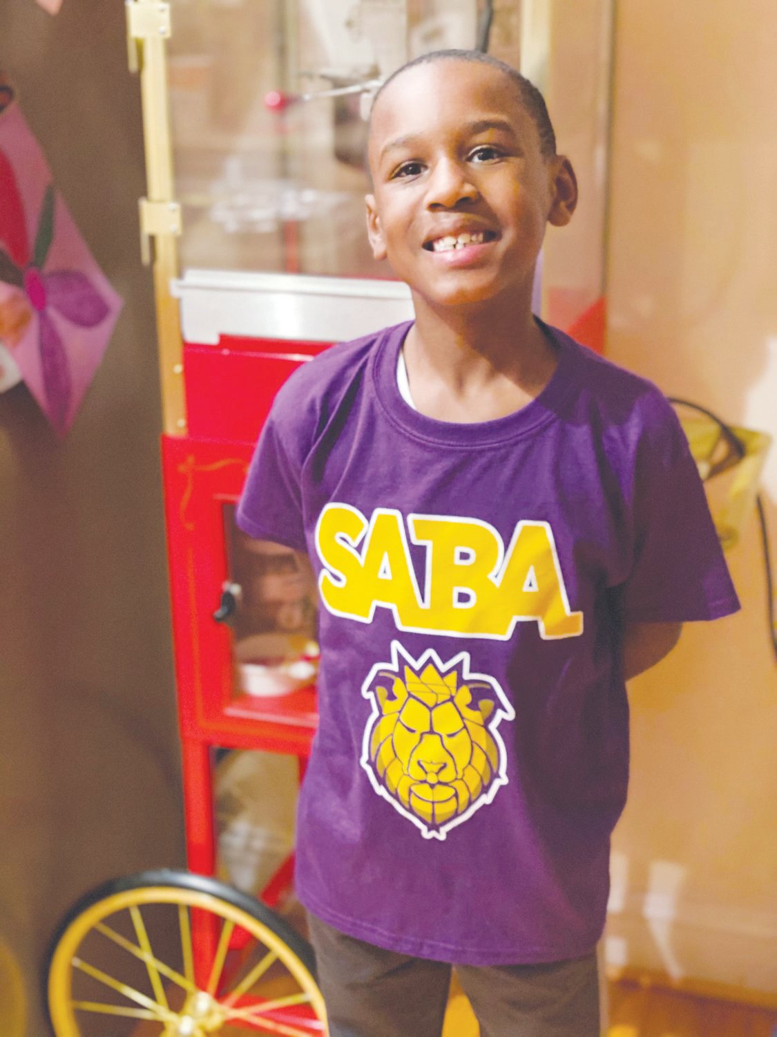 School of the Arts for Boys Academy founder Valencia Toomer’s son, Tyson Toomer, rocking one of the school’s new shirts last February. The school is set to open in fall 2022.