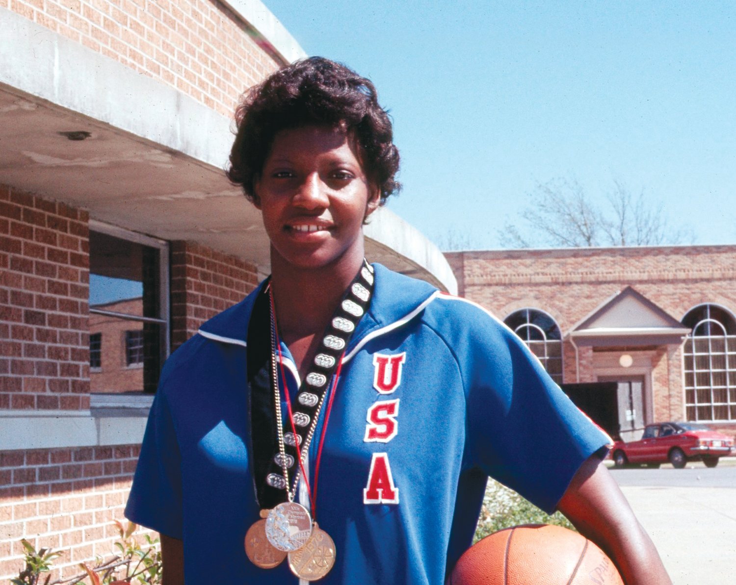 Lusia 'Lucy' Harris, shown in 1977 during her time at Delta State and wearing her Team USA basketball medals.