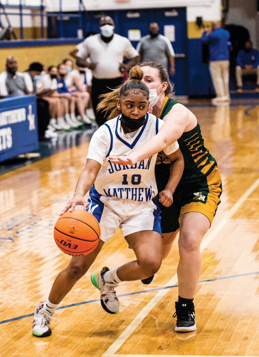 Jordan-Matthews senior Eillia Wright (10) fights through contact on her way to the hoop in the Jets' 50-21 win over the North Moore Mustangs last Wednesday. Wright has been described as the team's 'engine' by head coach Lamont Piggie. She had 19 points against the Mustangs.