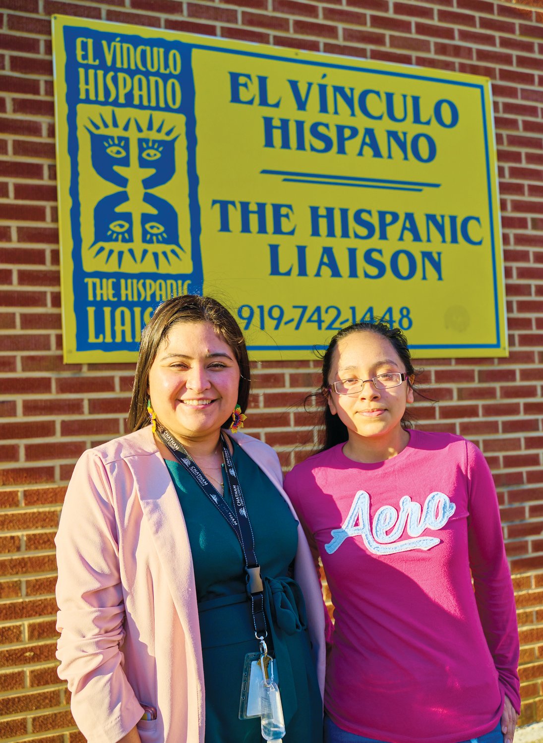 J-M senior Evelin Muñoz Tebalan (right) with the Hispanic Liaison's Selina Lopez, youth program director of Orgullo Latinx Pride. 'I'm also really excited to see where she goes, ‘cause she's just gonna be soaring,' Lopez said of Muñoz Tebalan.