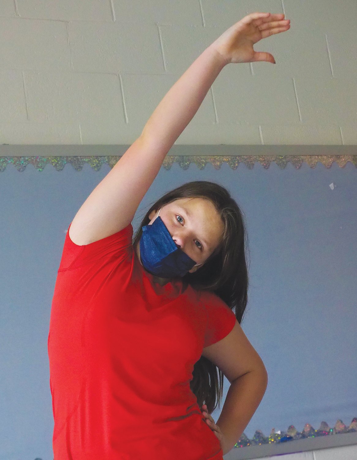 Student Morgaine E. slowly stretches from one side to the next to relieve tension.
