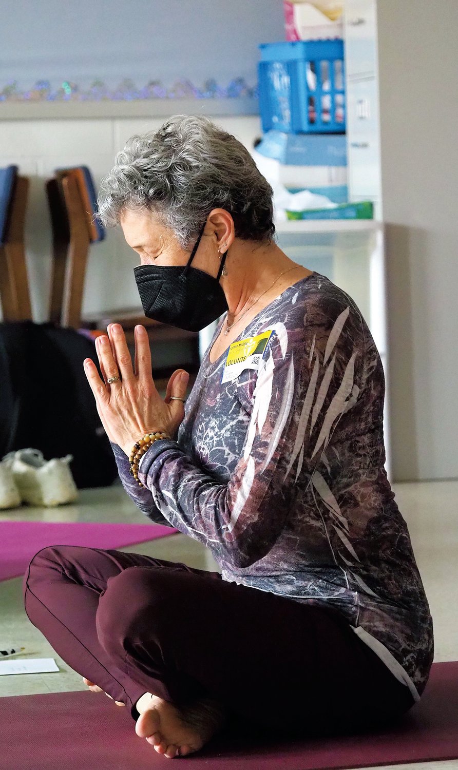 Instructor Marcia Cordova-Roth ends the class in a simple seated position of gratitude.