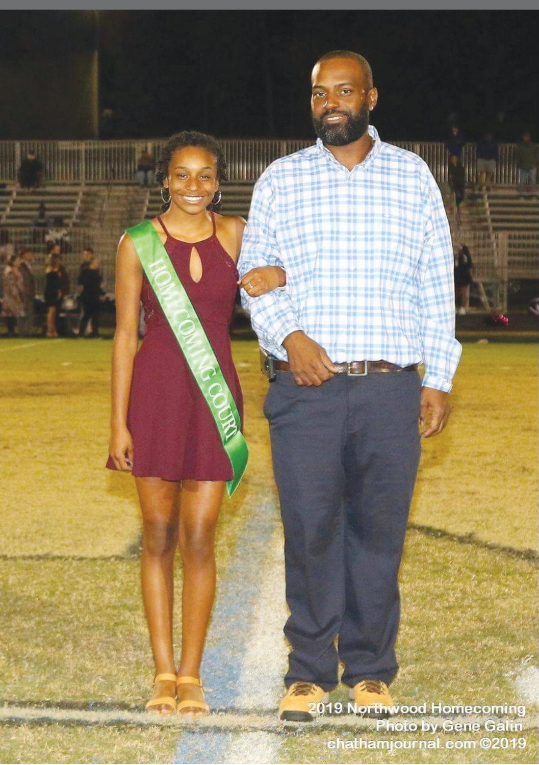Airryn Wharton and her father, Reginald Wharton Jr., pose during a homecoming event at Northwood High School. (NOTE TO CASEA - please crop this photo from bottom up to remove the photo credit).