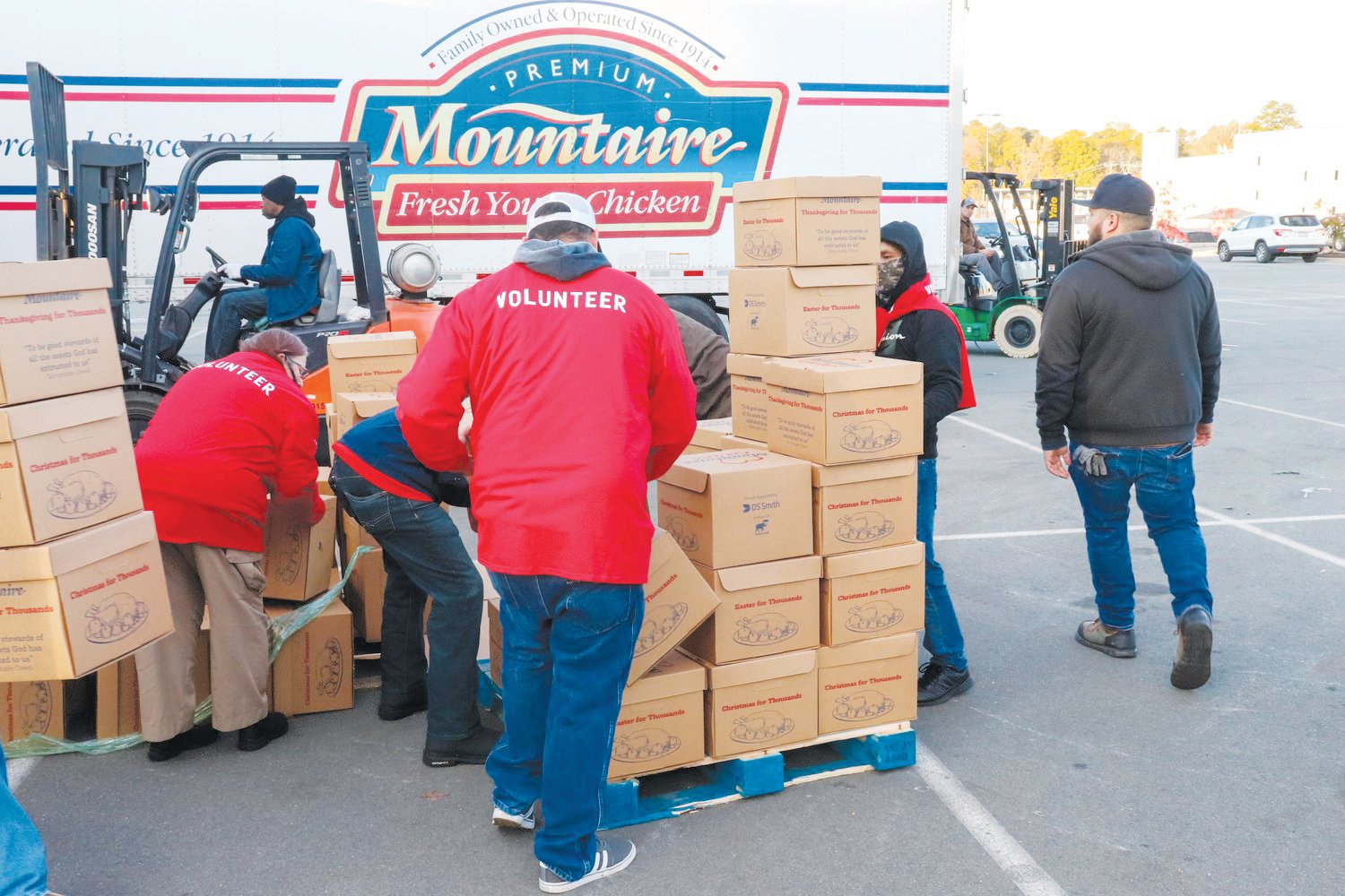 In this photos taken during last year's 'Thanksgiving for Thousands' event at Mountaire, employees and other volunteers worked to help distribute 5,000 boxes of food among churches and nonprofit organizations.