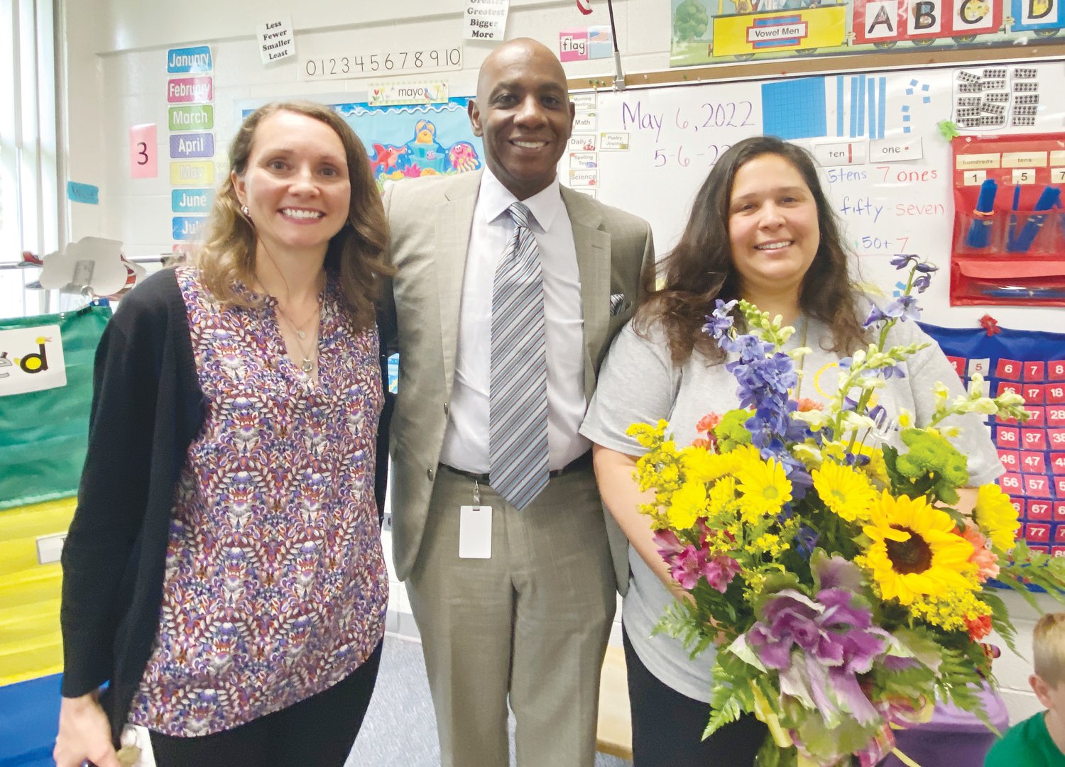 Superintendent Dr. Anthony Jackson (center) and North Chatham Elementary School Principal Dr. Janice Giles (left) congratulate Nanette Atkinson on her selection as the Chatham County Schools Instructional Assistant of the Year last Friday.