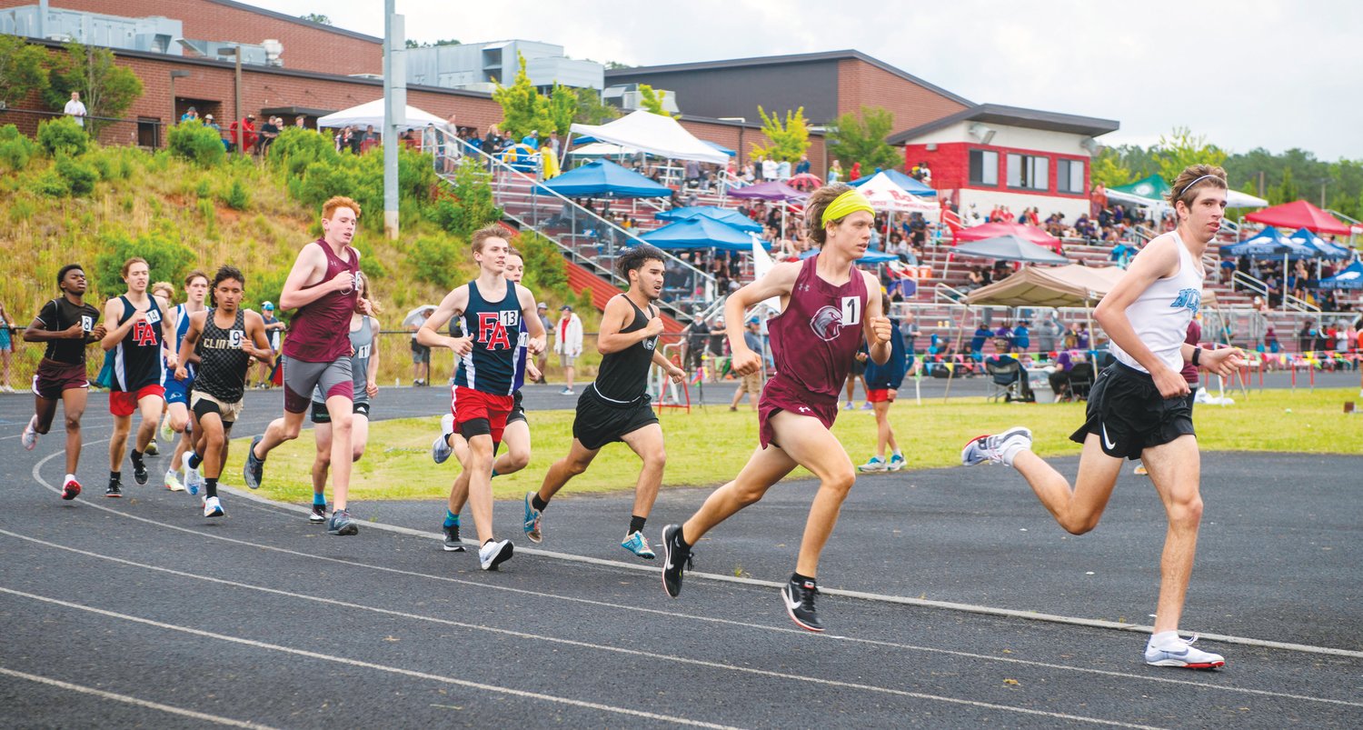 Contestants round a corner in the men's 1,600-meter run, including Seaforth freshman Jack Anstrom (1), during the NCHSAA 2A Mideast Regionals.at Franklinton High School last Saturday. Anstrom placed third in the event, along with a second-place finish in the 3,200, qualifying for states in both races.