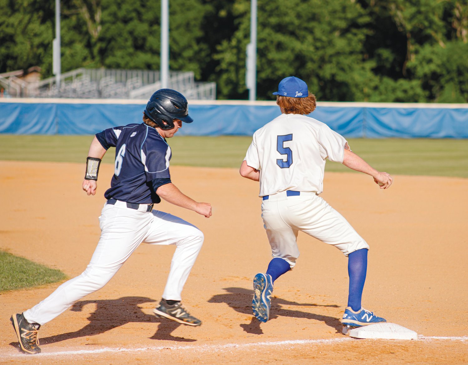 Jordan-Matthews junior first baseman Keigan Burt (5) tags Southwest Edgecombe  sophomore Aidan Knudsen out at first in the Jets' 3-1 win over the Cougars on May 10.