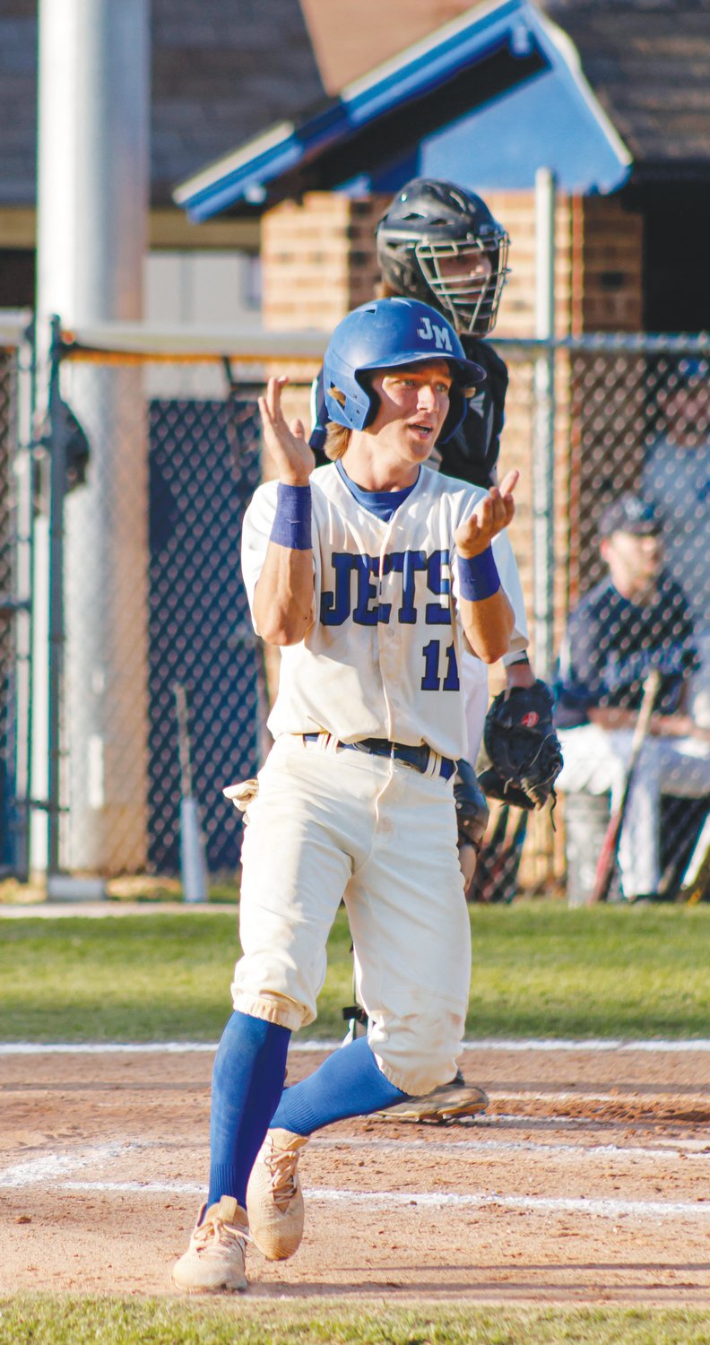 Jordan-Matthews sophomore Ian McMillan celebrates after touching home plate in the Jets' 3-1 first-round playoff win over the Southwest Edgecombe Cougars on May 10. McMillan was one of three Jets to score a run in the victory.