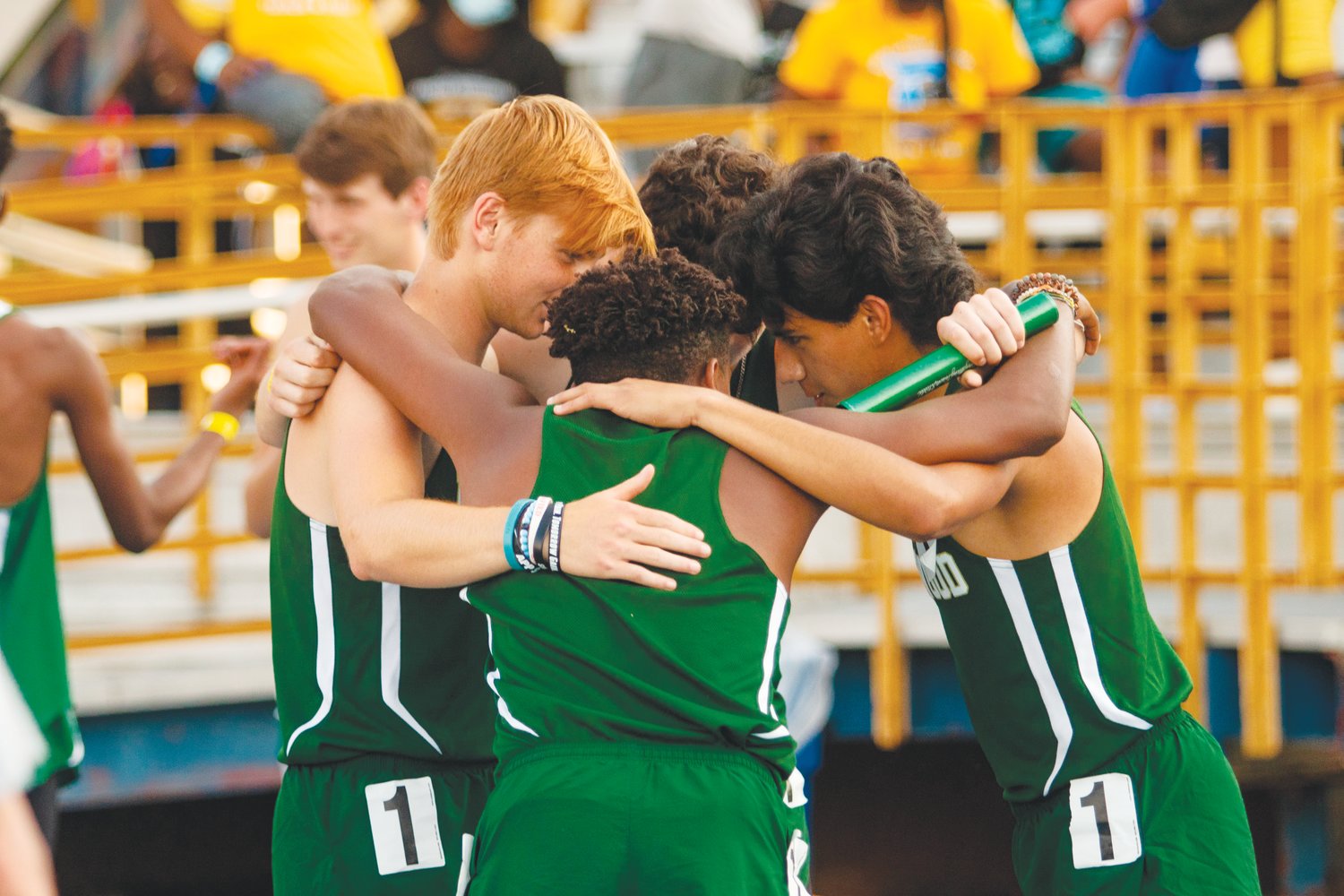 Northwood's men's 4x400-meter relay team, consisting of sophomore Noah Nielson, senior Jack Spotz, junior Christian Glick and senior Marco Sanchez, huddle up prior to running at the NCHSAA 3A Track & Field State Championships last Friday. The team took eighth place with a time of 3:29.50.