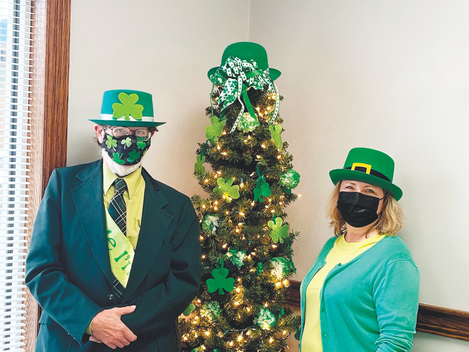 Bill Widman, left, poses with Eastern Chatham Senior Center manager Liz Lahti during the Council on Aging’s Saint Patrick’s Day celebration in Siler City in March.