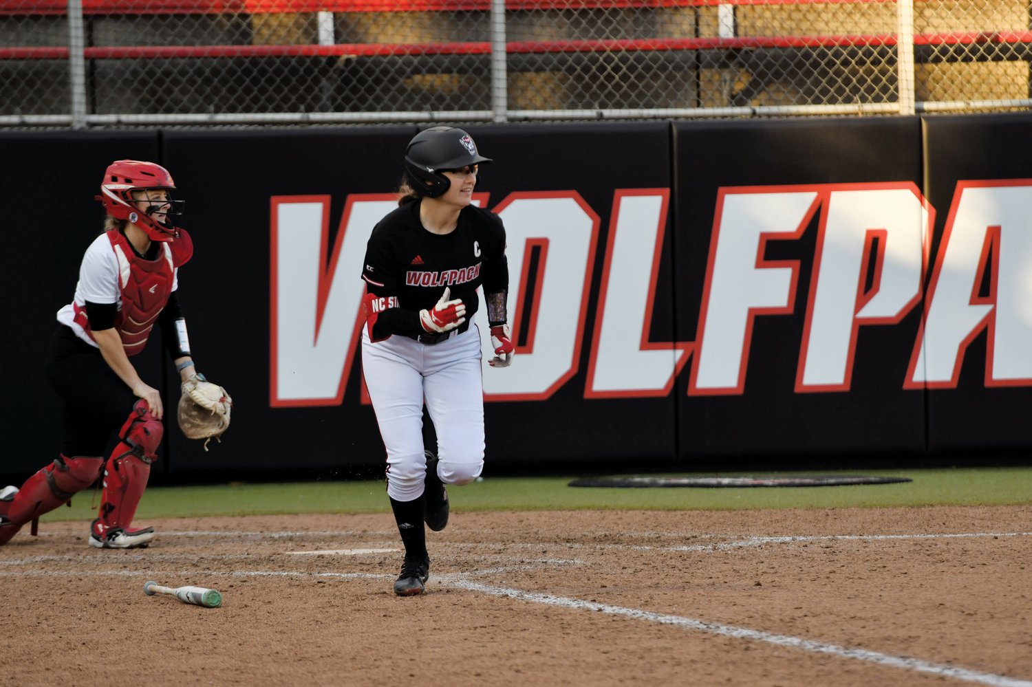 N.C. State outfielder Carson Shaner (in black) darts toward first base after making contact with a pitch in the Wolfpack's 5-2 win over the Fairfield Stags on Feb. 18.