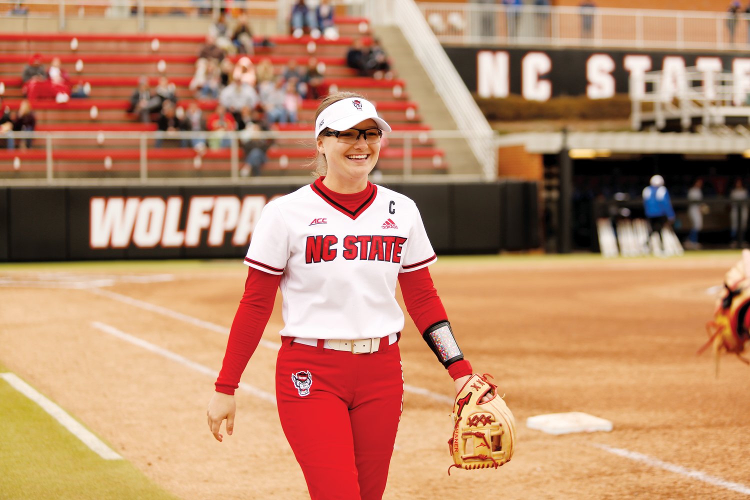 N.C. State outfielder Carson Shaner walks down the first base line on her way to the outfield in the Wolfpack's 12-4 loss to Delaware on Feb. 26. Shaner was 'in complete shock and honor' to be voted team captain for the 2021-22 season.