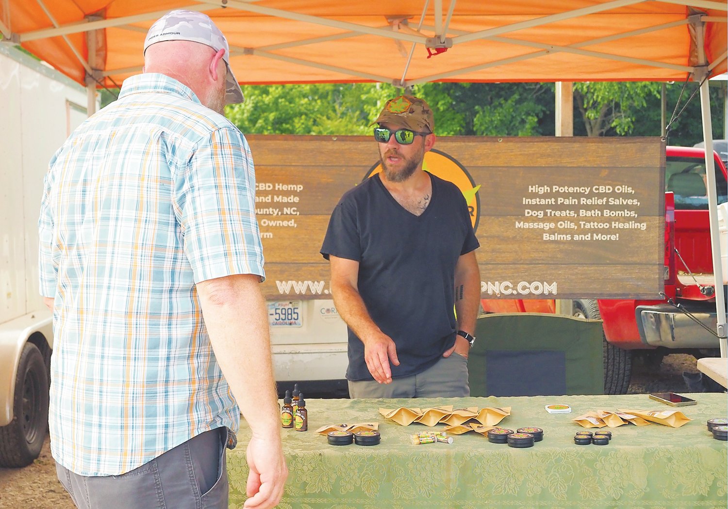 Rocky River Hemp, one of the regulars at the Pittsboro Farmers Market, is a family business in Chatham County offering a variety of hemp-based products. Co-owner Sam Brownfield spoke with a customer at last week's market.