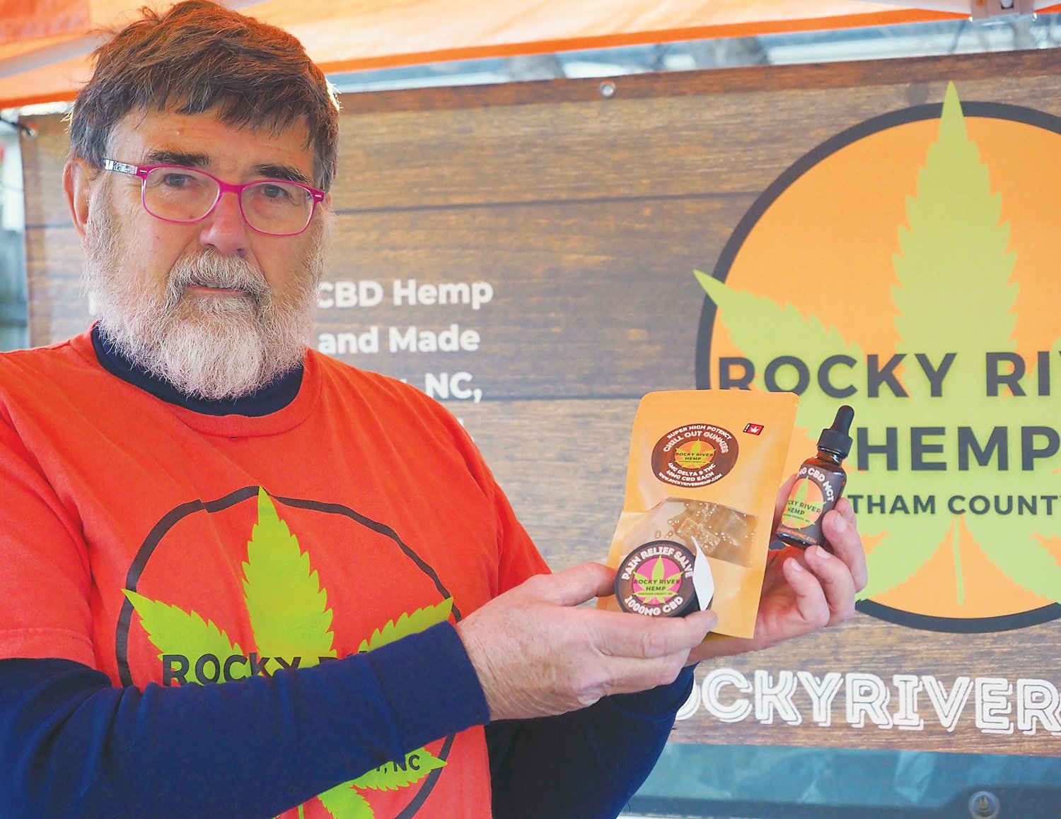 Rick Brownfield displays Rocky River Hemp products at his business' booth at the Pittsboro Farmers Market.