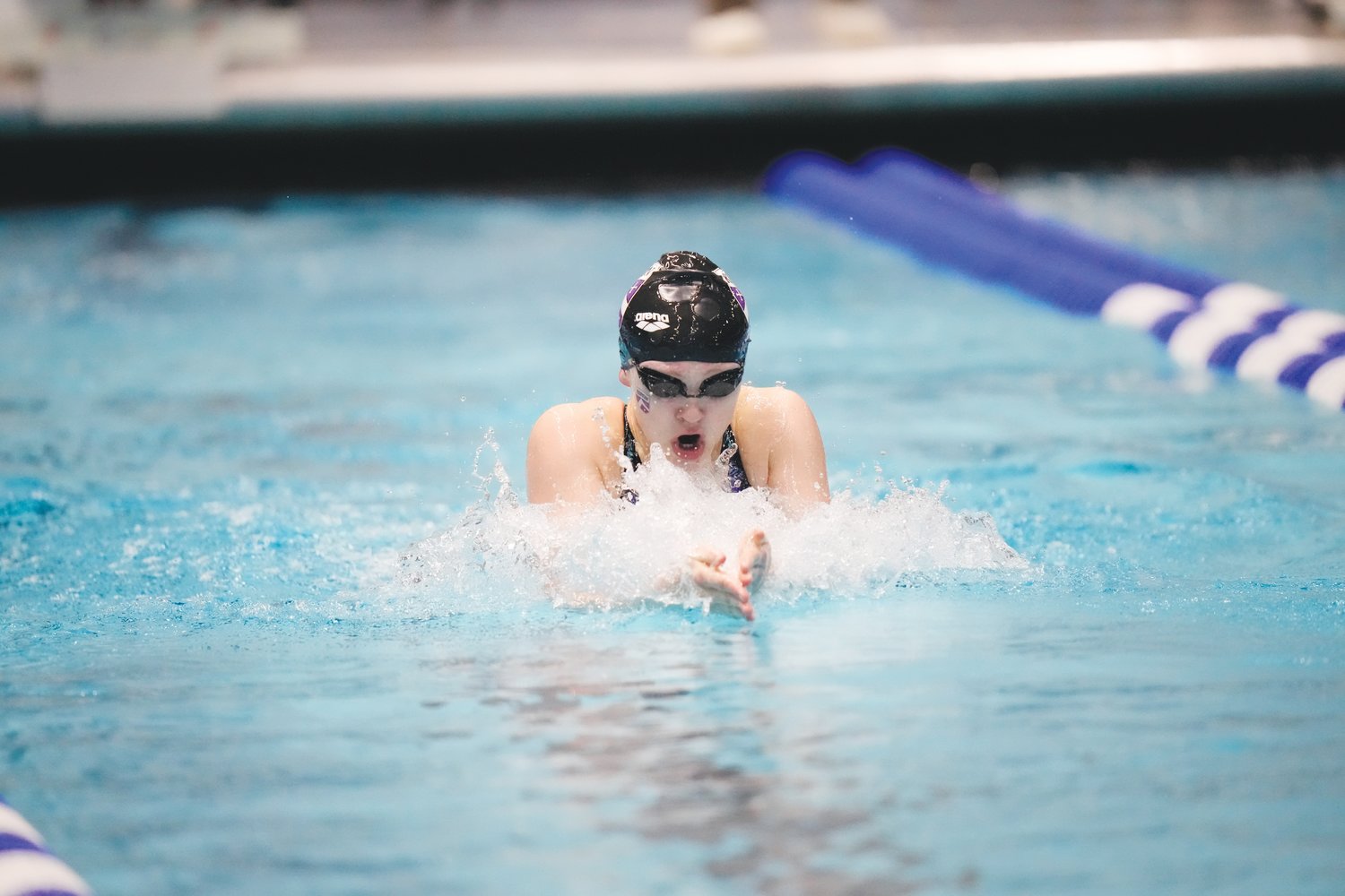 Kenyon swimmer Jennah Fadely slices through the water in one of her 5 races during the NCAA Division III Swimming & Diving National Championships in Indianapolis in March.