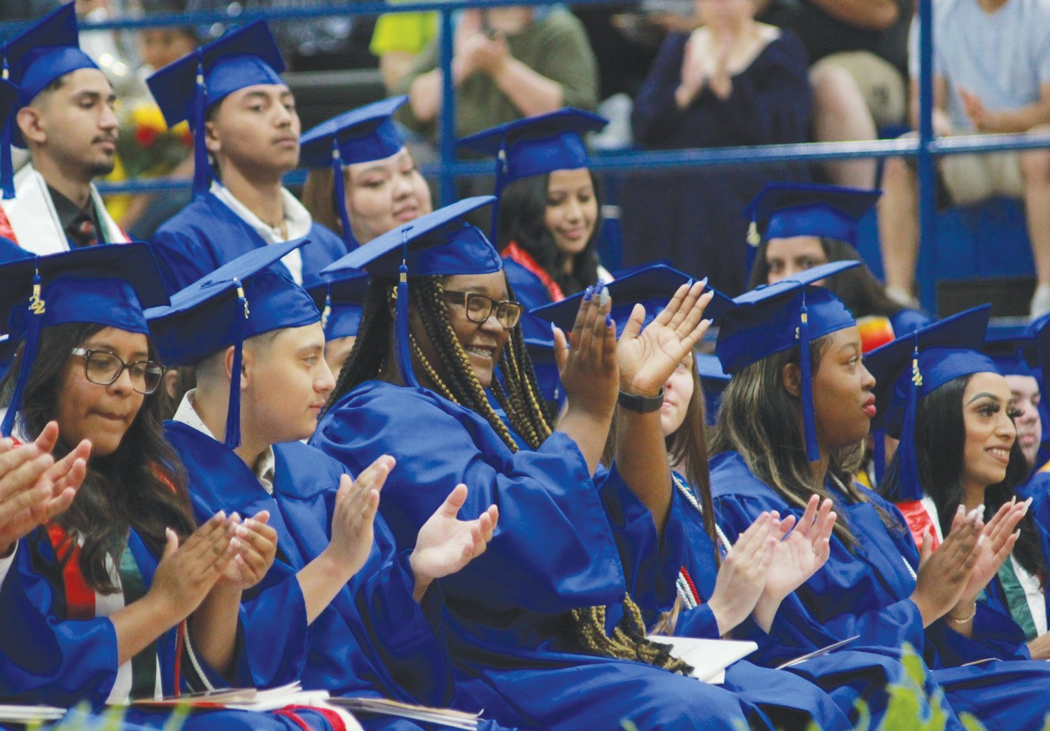 The Jordan-Matthews High School graduating class of 2022 applaud each other as they receive their diplomas on Saturday at the Jordan-Matthews High School gymnasium in Siler City.