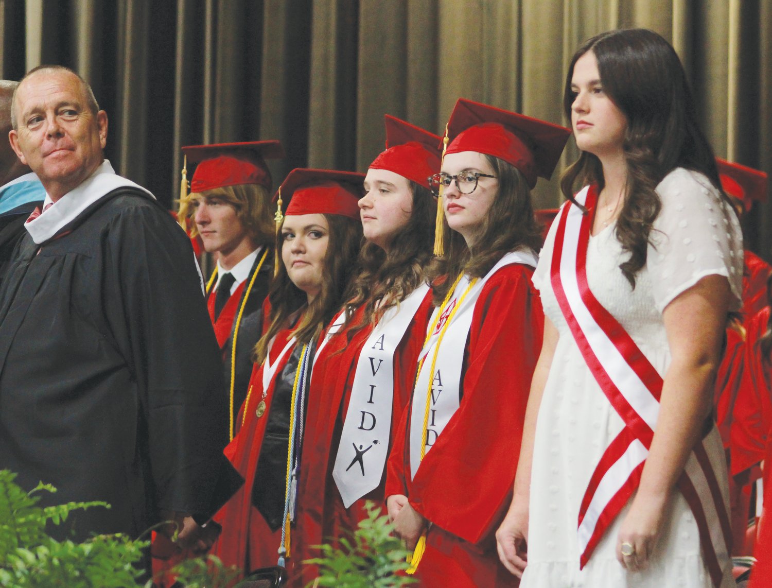 The student speakers of the Chatham Central High School class of 2022 are escorted to their seats before their graduation on Friday at the Dennis A. Wicker Civic Center in Sanford.