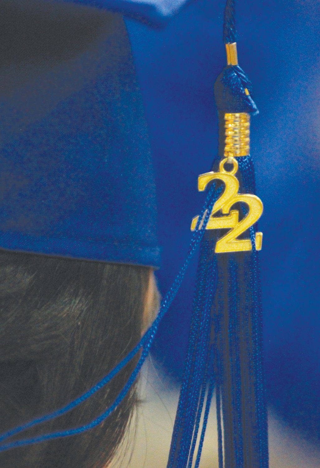 A blue tassel is decorated with a gold 22 on the capo of one of the Jordan-Matthews graduating seniors on Saturday at the Jordan-Matthews High School gymnasium in Siler City.