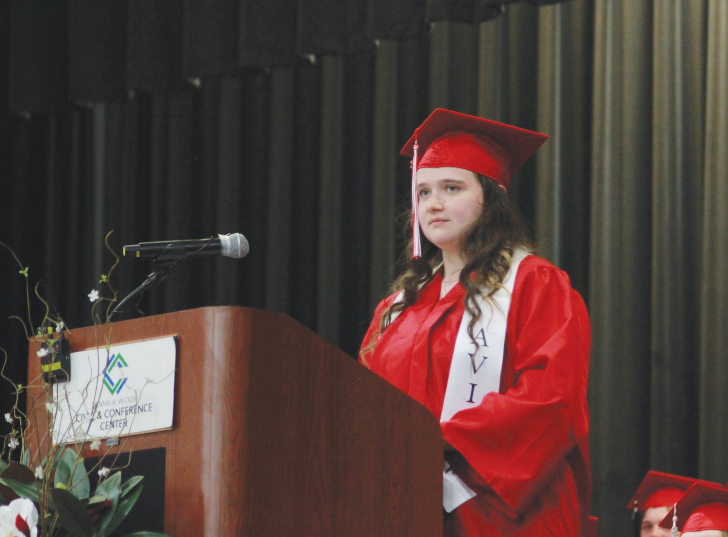 Graduating senior Kaylee Maness sings a solo to the Chatham Central High School Class of 2022 on Friday at the Dennis A. Wicker Civic Center in Sanford.
