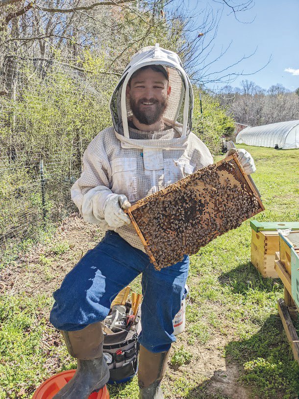 Mitchell Shivers is one of the owners and beekeepers at Three Dog Apiary in Pittsboro.