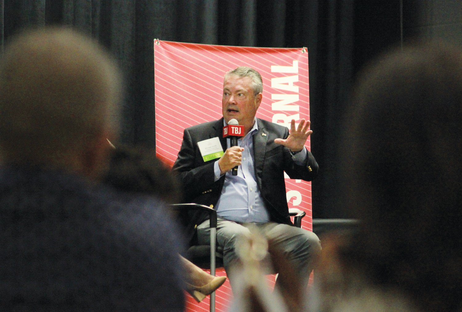 Michael Smith, the president of the Chatham Economic Development Corporation, speaks to the audience during the 'Corridors of Opportunity' panel last Thursday at the Chatham County Agriculture & Conference Center in Pittsboro.