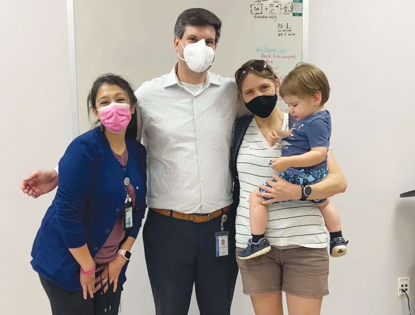 Mike Zelek, the director of the Chatham County Public Health Department, poses with wife Jess Edwards and son Nico — who received his first COVID vaccination shot recently — and Public Health Nurse Evi Bonilla.