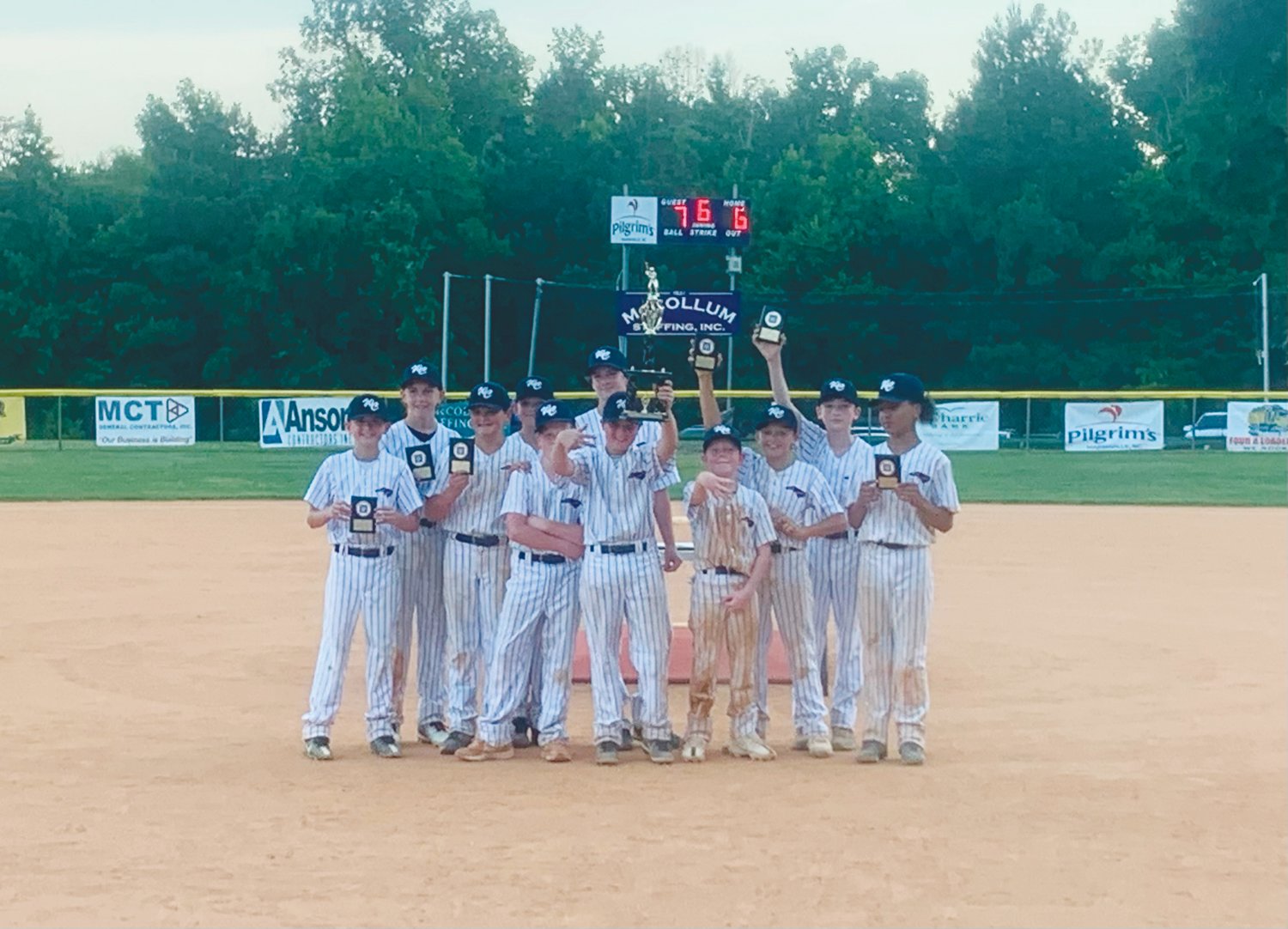 The West Chatham 12U All-Stars pose for photos holding their trophies after winning the N.C. Dixie Youth District 1 O-Zone championship on June 22. With the win, West Chatham moves on to the Dixie Youth state tournament in early July.