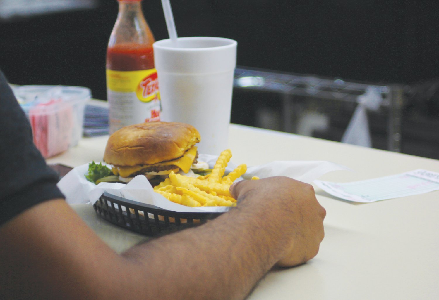 A burger and fries are set in front of a customer at Down Town Cafe, which celebrated its held its official opening Thursday in downtown Siler City..