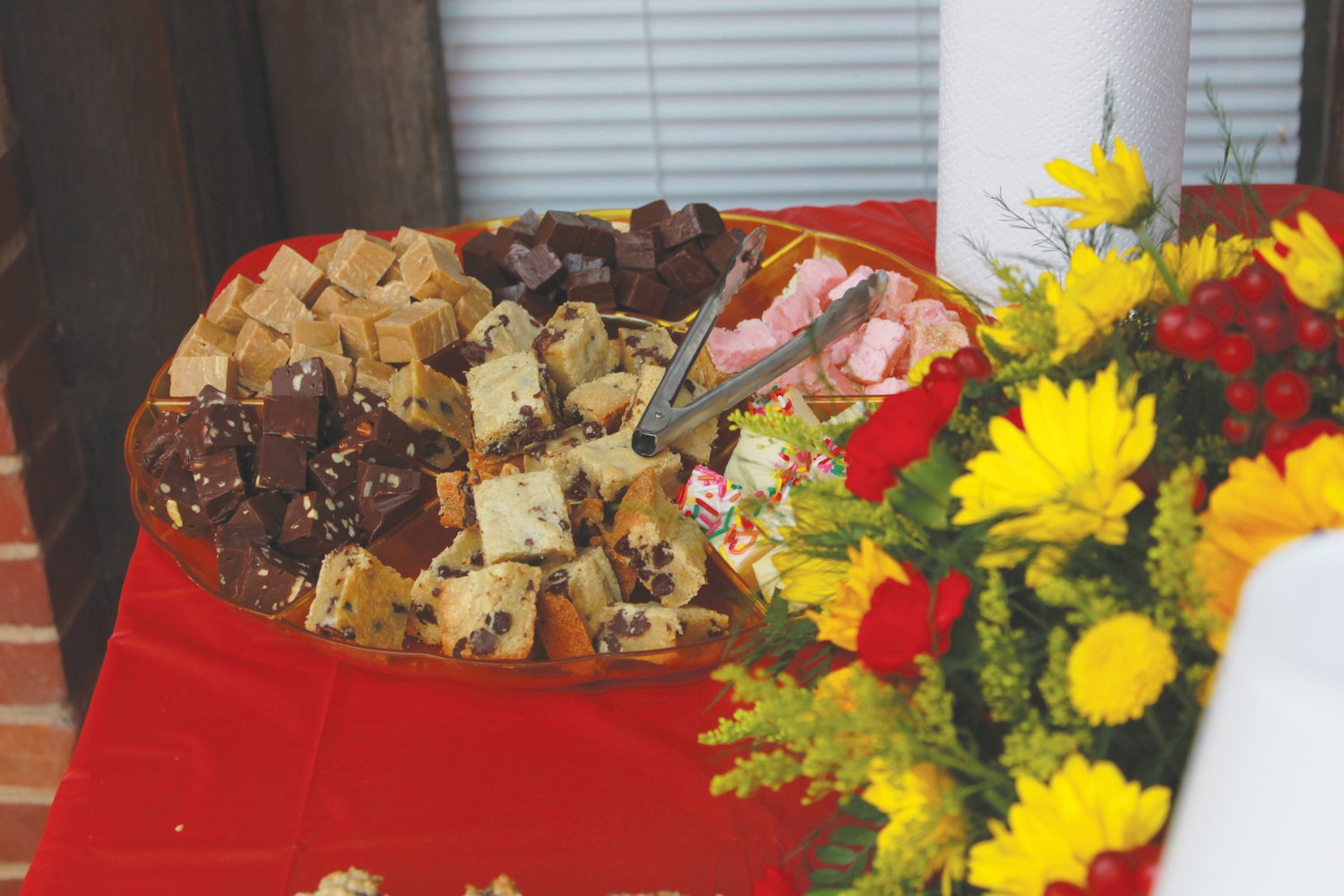 Samples of fudge lay on a table for cutomers to try during the Down Town Cafe official ribbon cutting ceremony on Thursday in downtown Siler City. The flavors of fudge included sugar cookie, chocolate pecan, strawberry shortcake and more..