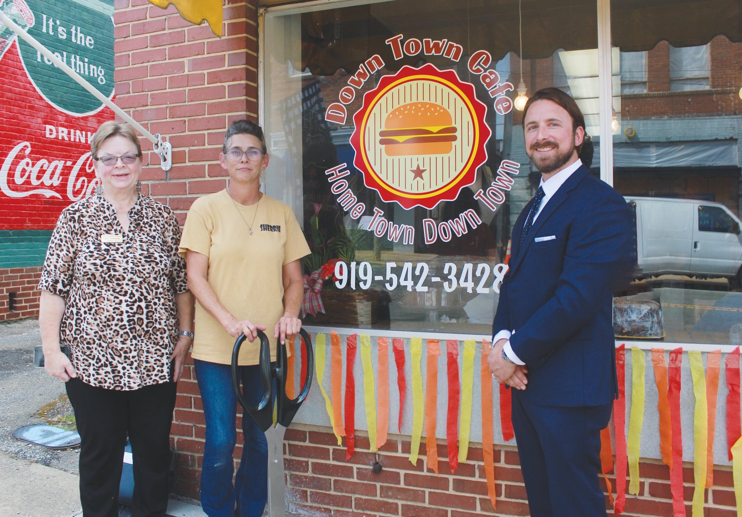 Chamber of Commerce President Cindy Poindexter, restaurant owner Sherrie Hatfield and Phillip Pappas, the Chatham County Small Business Center coordinator, stand in front of the Down Town Café in Siler City.