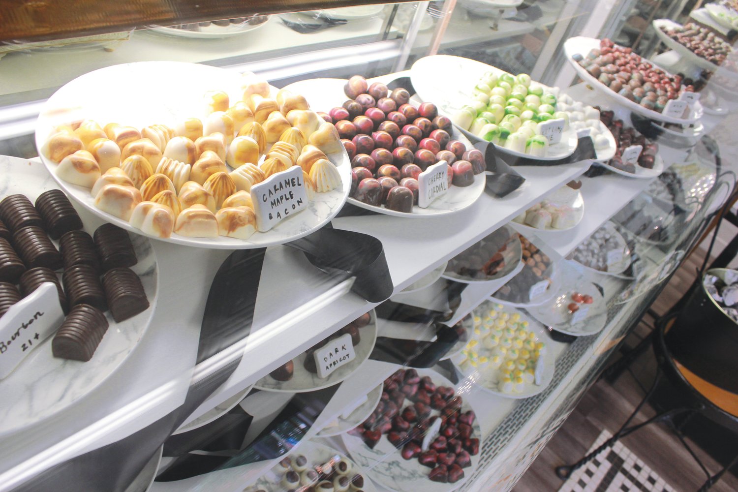Dozens of truffles and bagged candies are on display at the front counter at the Chocolate Cellar Deux in downtown Pittsboro. The wide variety of truffle flavors include chocolate, saltred caramel, Irish cream, lemon merengue, glazed pecan, pomegranete and more.