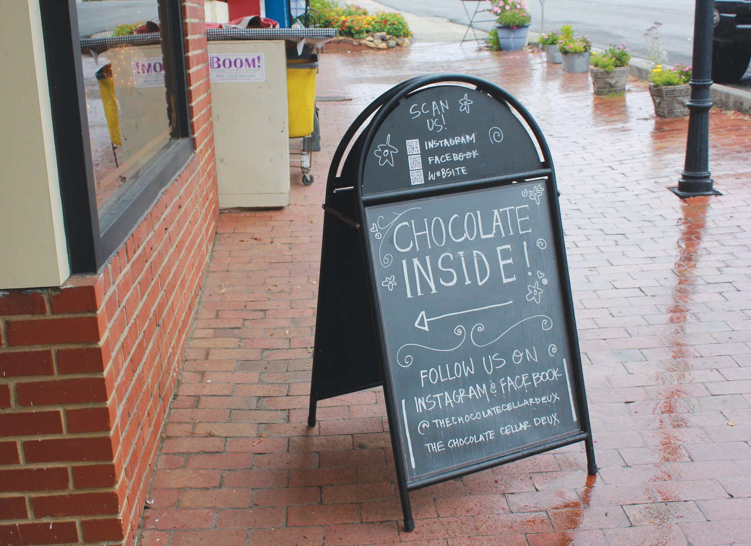A sign on the streets of downtown Pittsboro points customers into the Chocolate Cellar Deux.