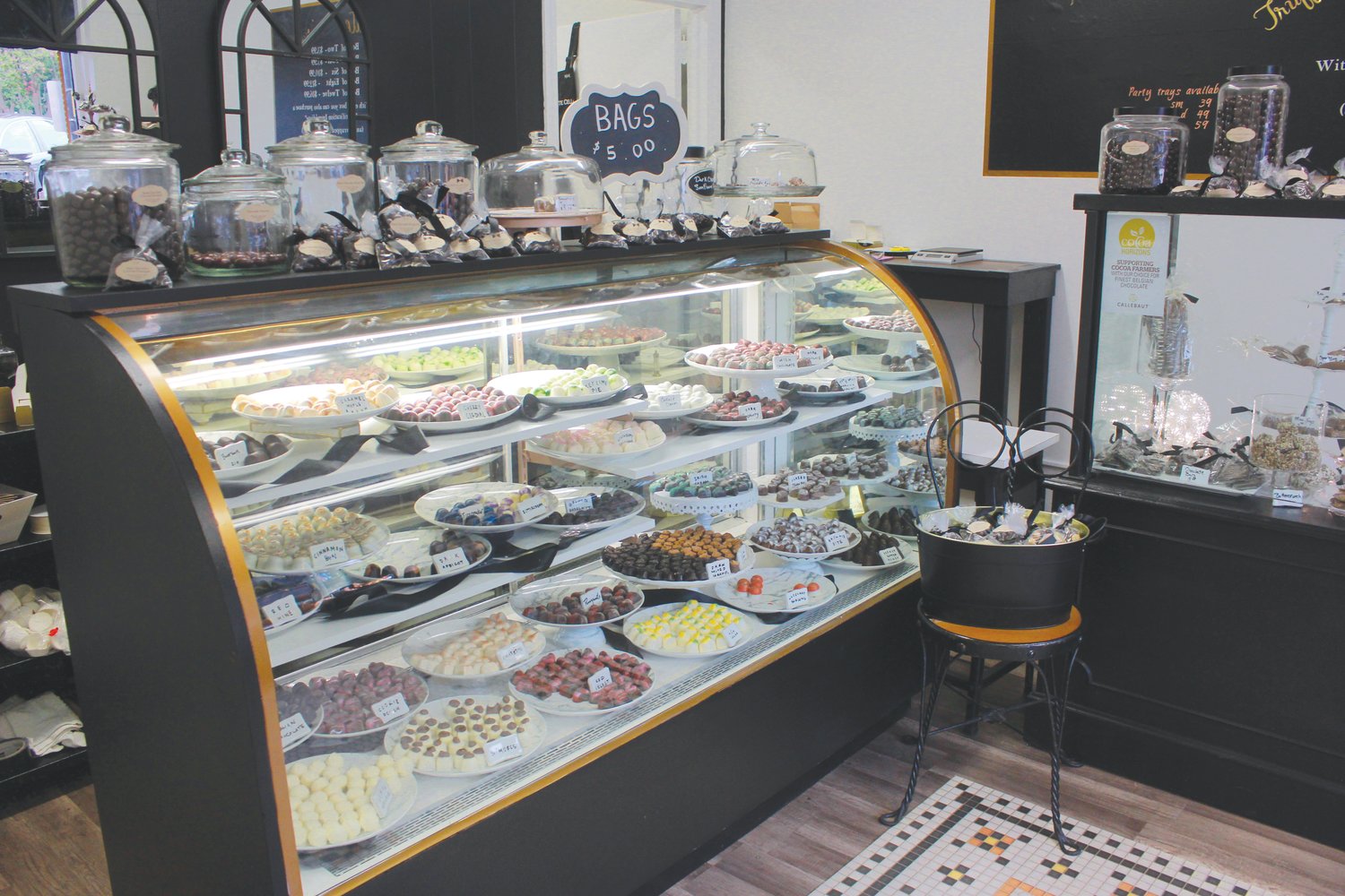 Dozens of truffles and bagged candies are on display at the front counter at the Chocolate Cellar Deux in downtown Pittsboro. The wide variety of truffle flavors include chocolate, salted caramel, Irish cream, lemon meringue, glazed pecan, pomegranate and more.