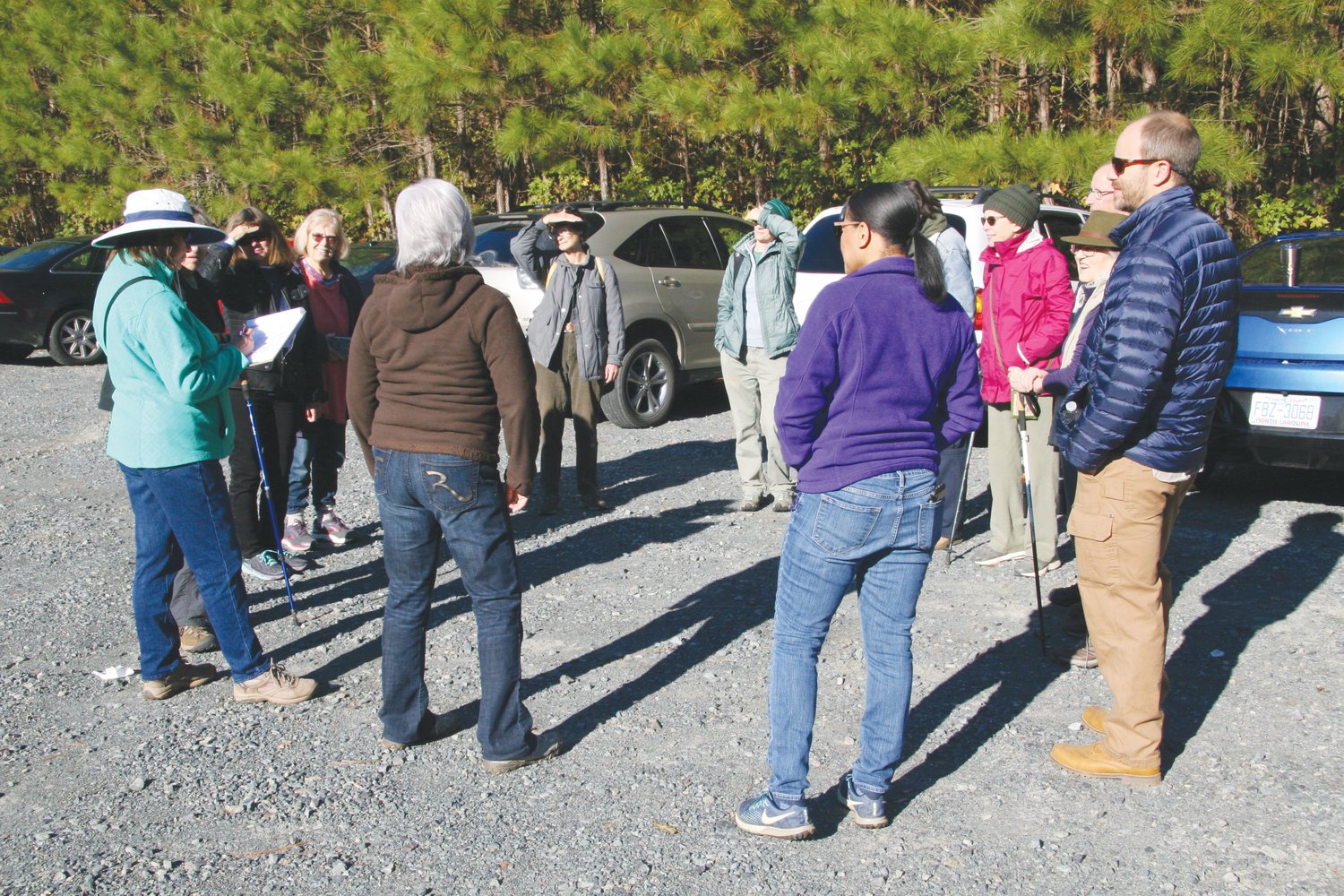 Gretchen Smith checks in attendees before a guided hike in the Lower Haw River State Natural Area.