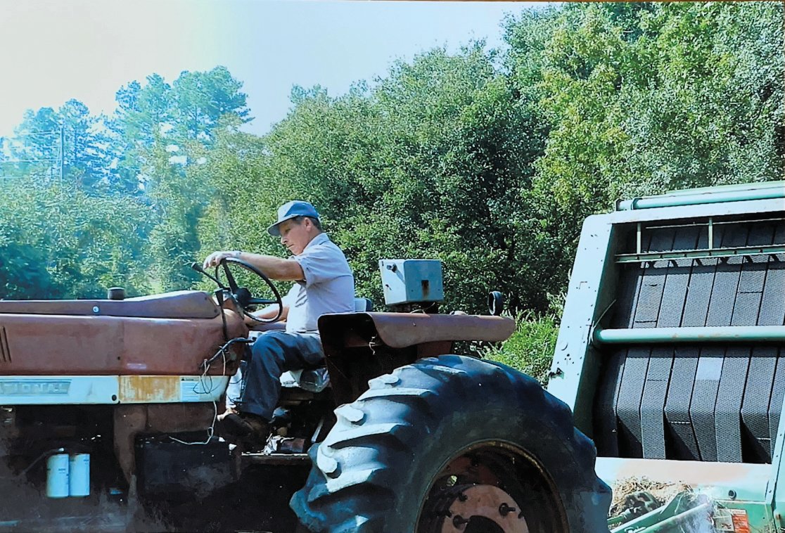 This 2010 photo shows Wayne Strowd at work at Strowd Brothers Dairy in Pittsboro.
